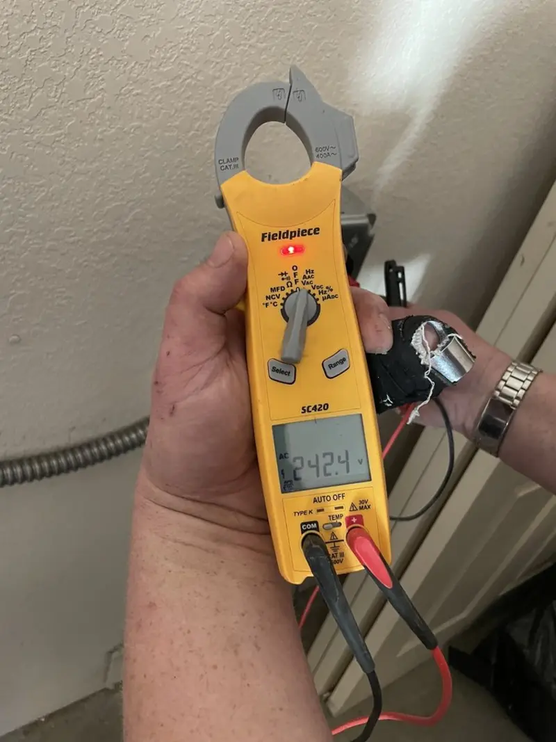 Voltage testing with clamp meter during Generator Installation in Belmont